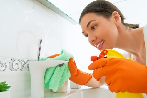 Cleaner working in a W1T flat with compact rooms and modern finishes